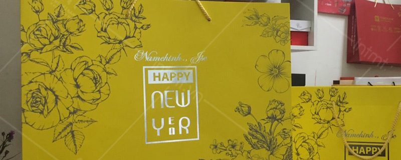 tui-giay-dung-qua-tet-mau-vang-ep-nhu túi giấy đựng quà tết vàng ép nhũ