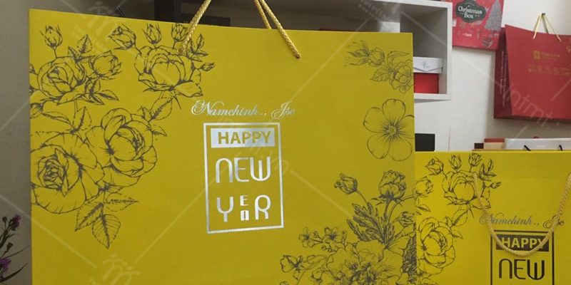 tui-giay-dung-qua-tet-mau-vang-ep-nhu túi giấy đựng quà tết vàng ép nhũ